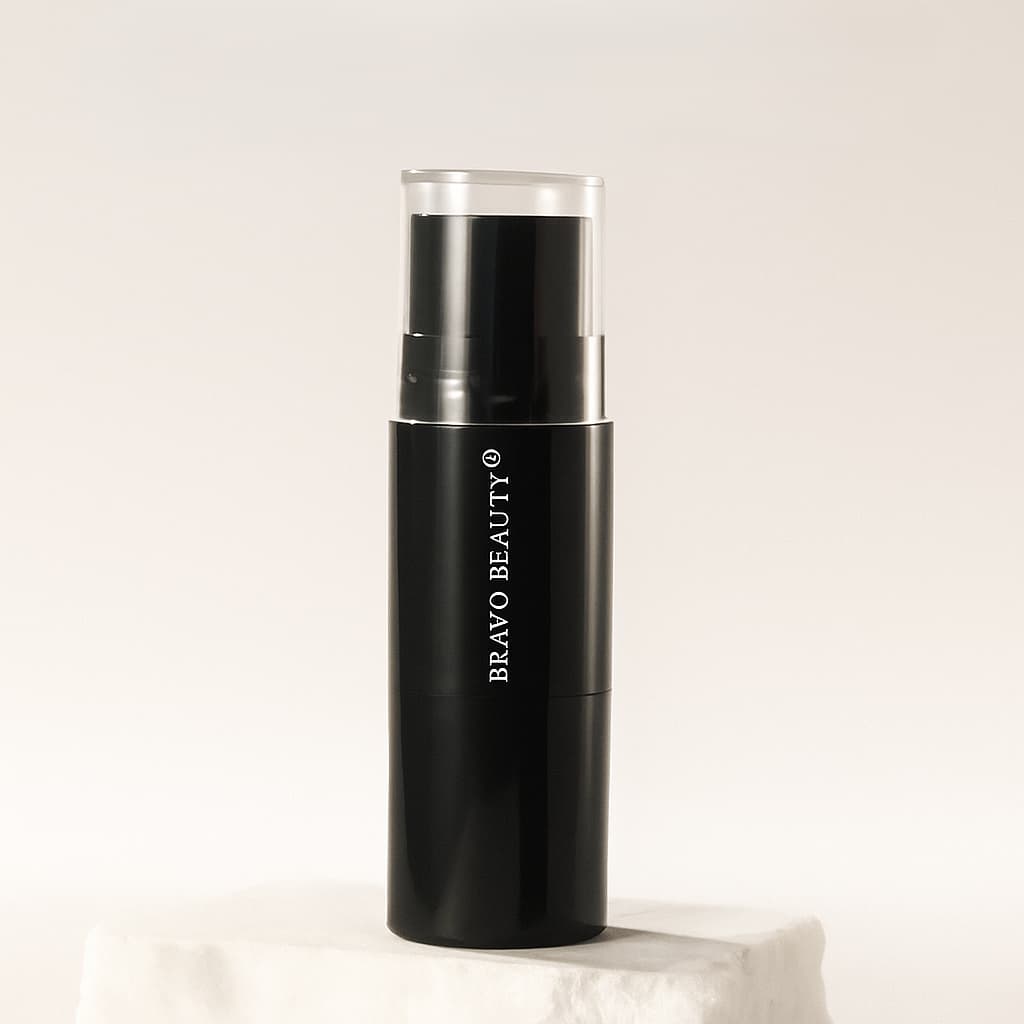 Black makeup bottle with 'Iravo Beauty' branding on a light background