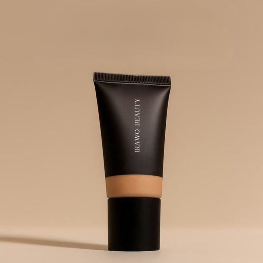 Black tube of Irawo Beauty foundation on a beige background