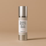 Skincare bottle labeled 'Irawo Beauty Blemish Solution' on a beige background