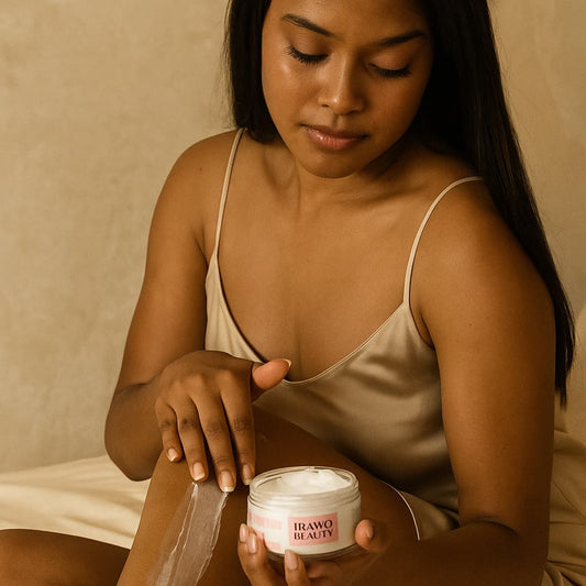 Woman applying cream from a jar labeled IRAWO BEAUTY against a beige background