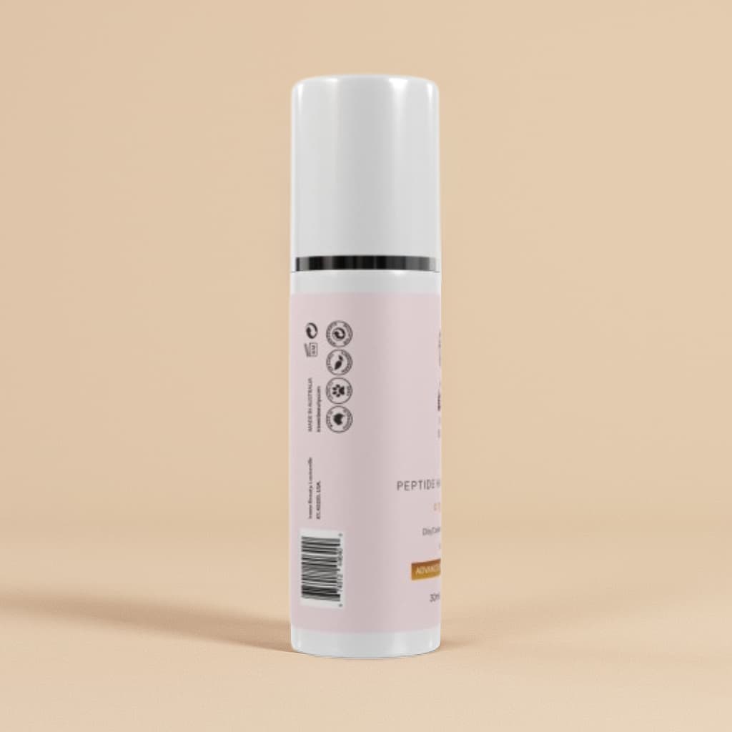 White serum bottle with a pink label on a beige background