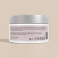 White jar with a silver lid on a beige background