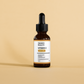 Irawo Beauty Vitamin C serum bottle with dropper on a beige background
